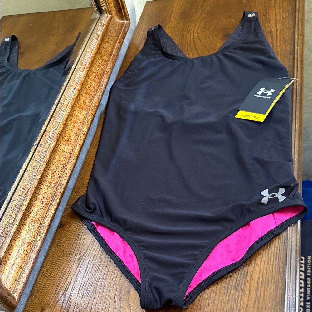 Under Armour girls One Piece Black swimsuit with pink metallic accents. Size 16.